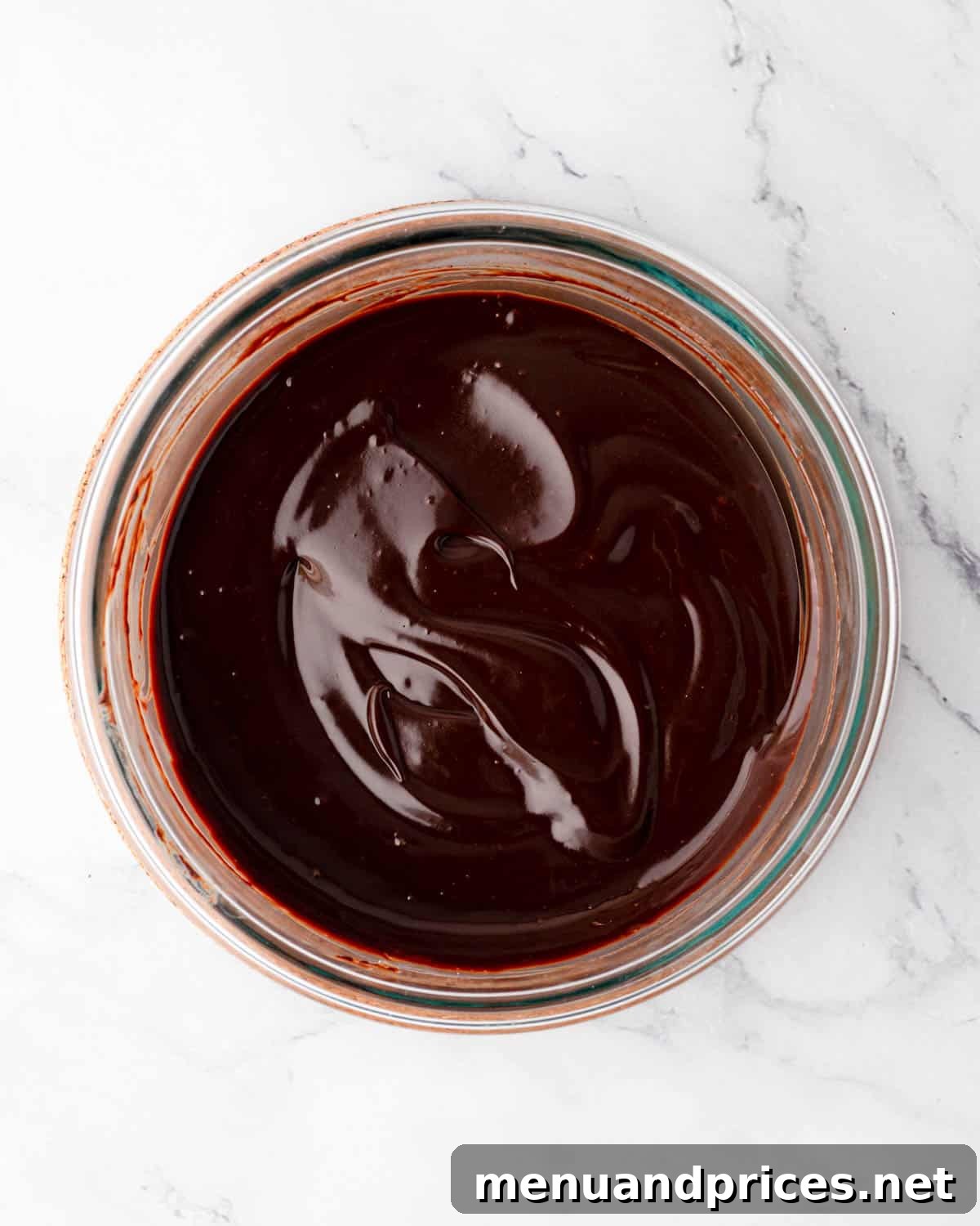 The finished, perfectly spreadable chocolate ganache in a bowl, ready for cake assembly.