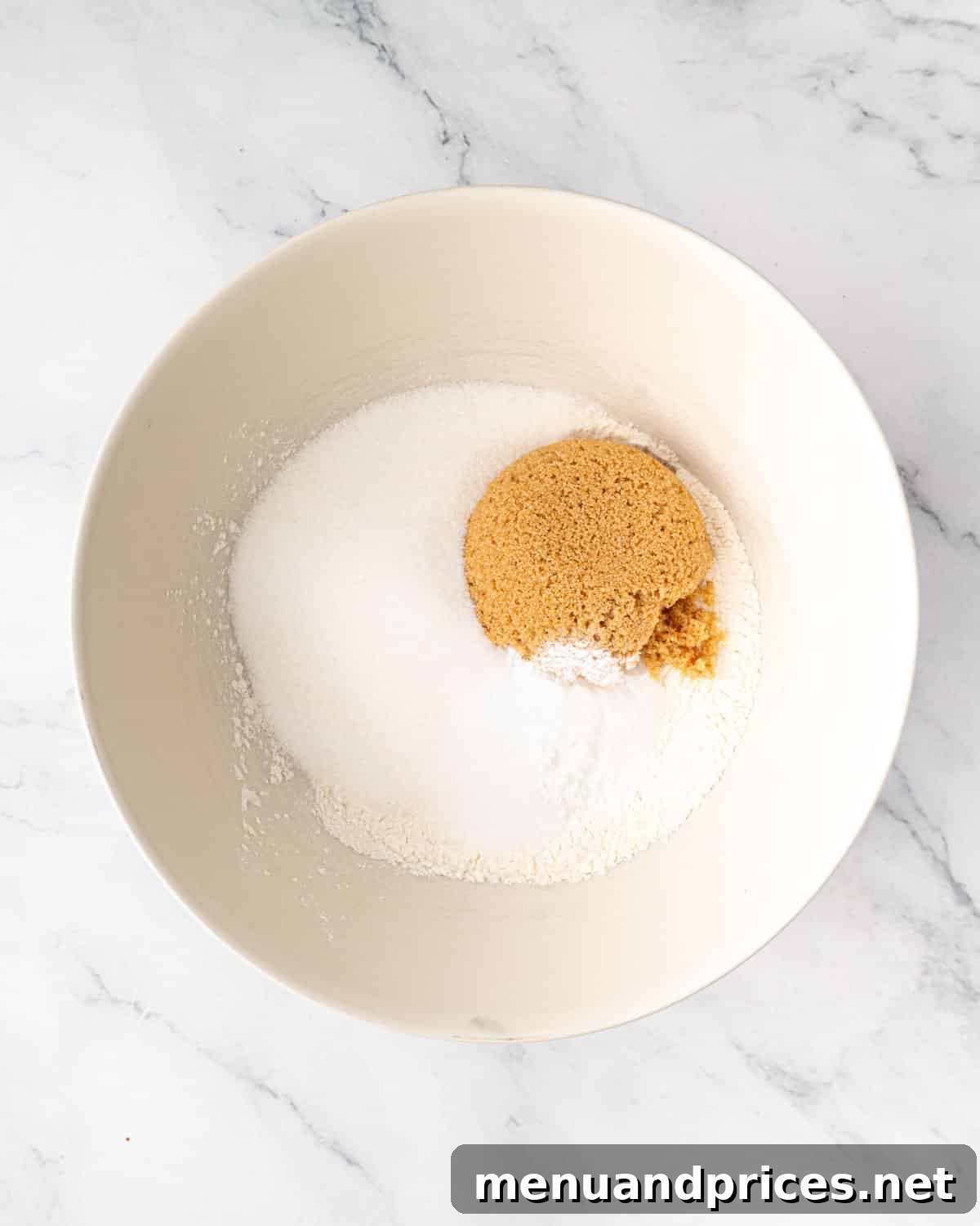 A bowl containing the dry ingredients for the chocolate cake batter, perfectly combined.