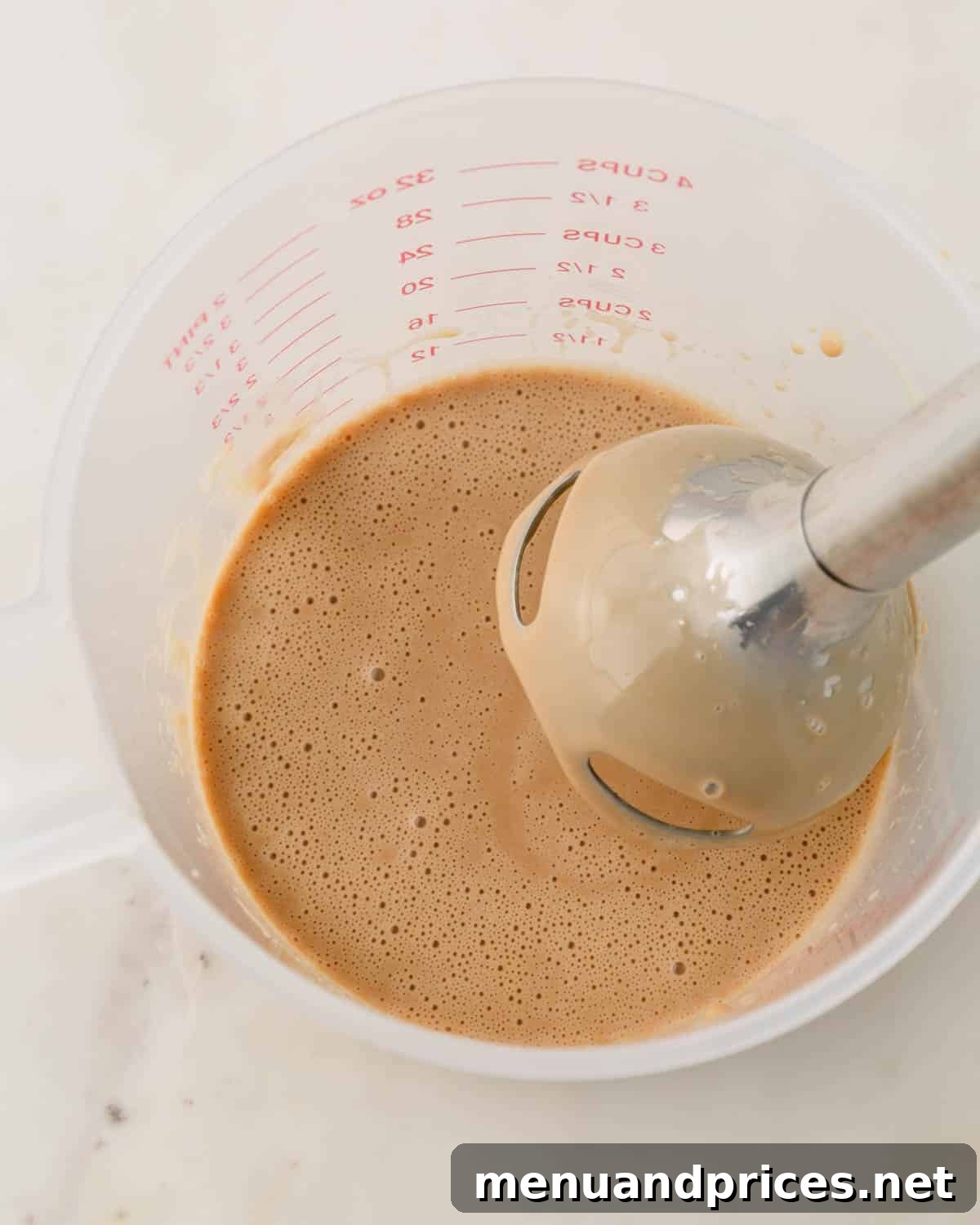 Espresso Dream Macarons 19 The espresso ganache is being whipped with an immersion blender.