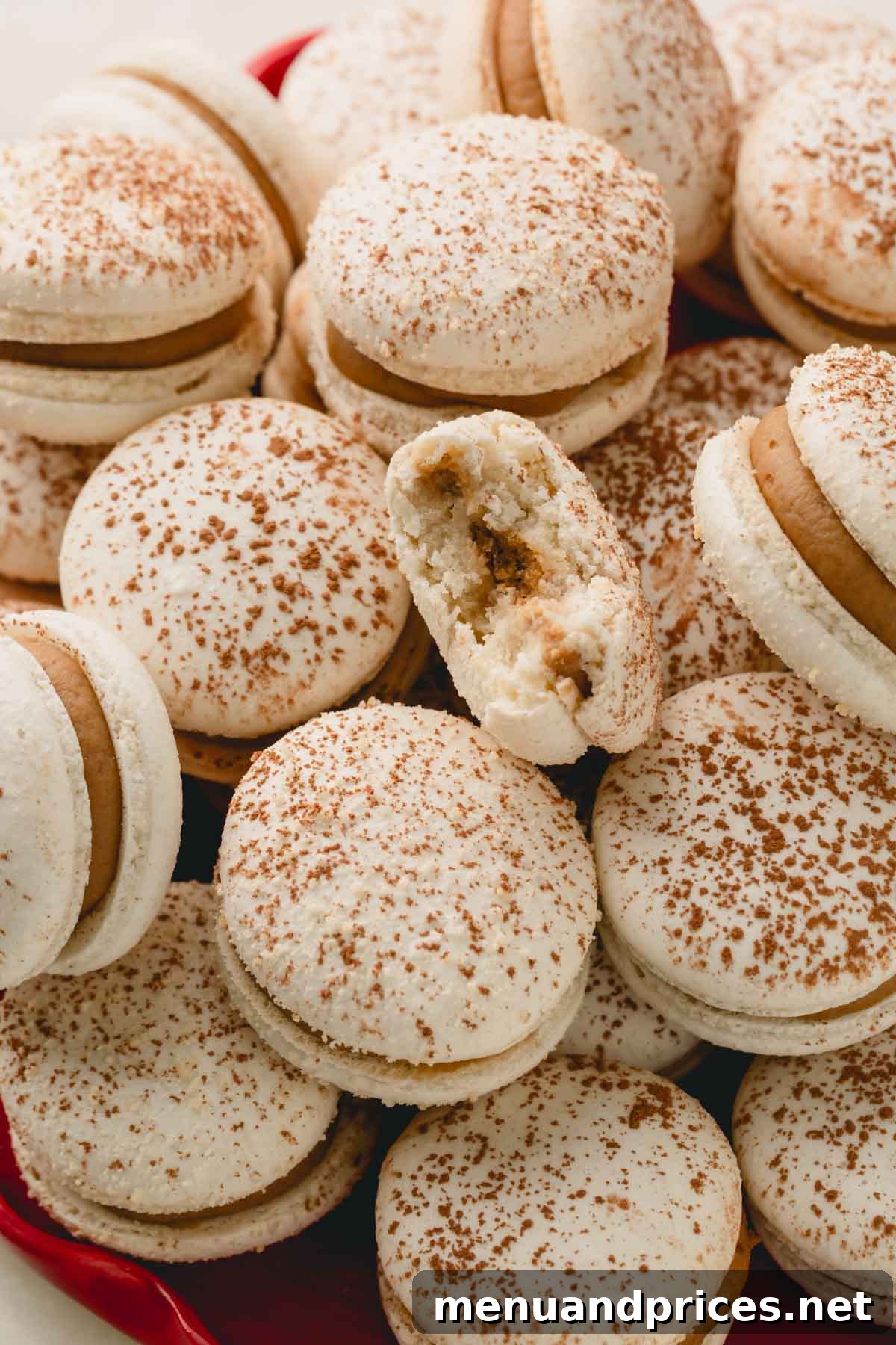 Espresso Dream Macarons 4 Upclose shot of tiramisu macarons with one macaron bitten.