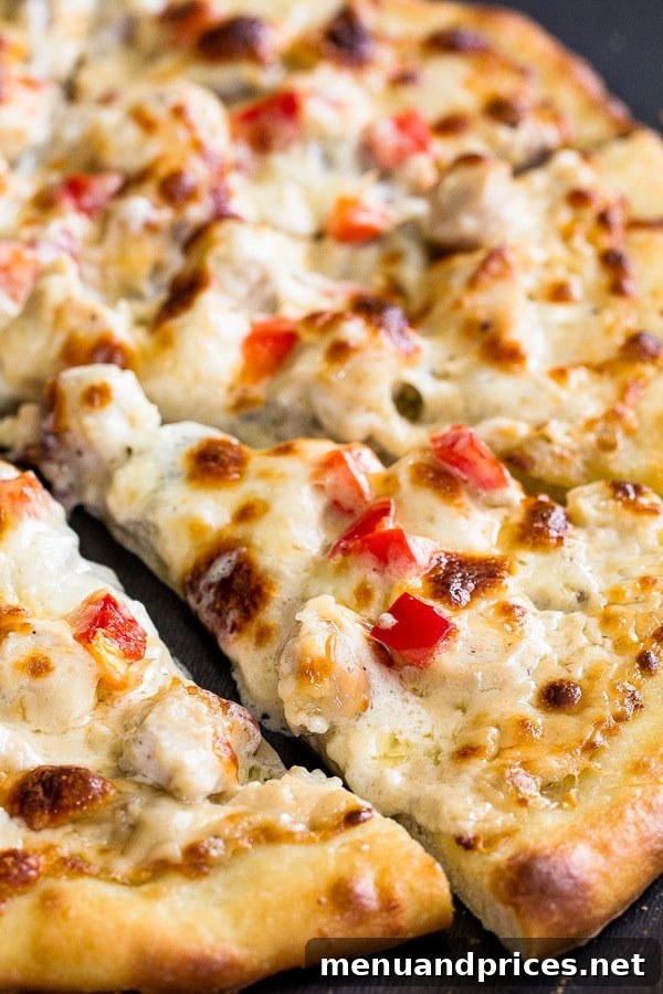 Gourmet Chicken Alfredo Pizza 5 Tips and tricks for delicious thin crust pizza with creamy cheesy chicken alfredo topping.