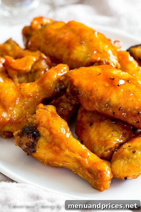 Fiery Jamaican Jerk Wings 2 Sticky, messy, and absolutely irresistible, these Jamaican jerk chicken wings are baked to crisp perfection and tossed in your favorite jerk sauce.