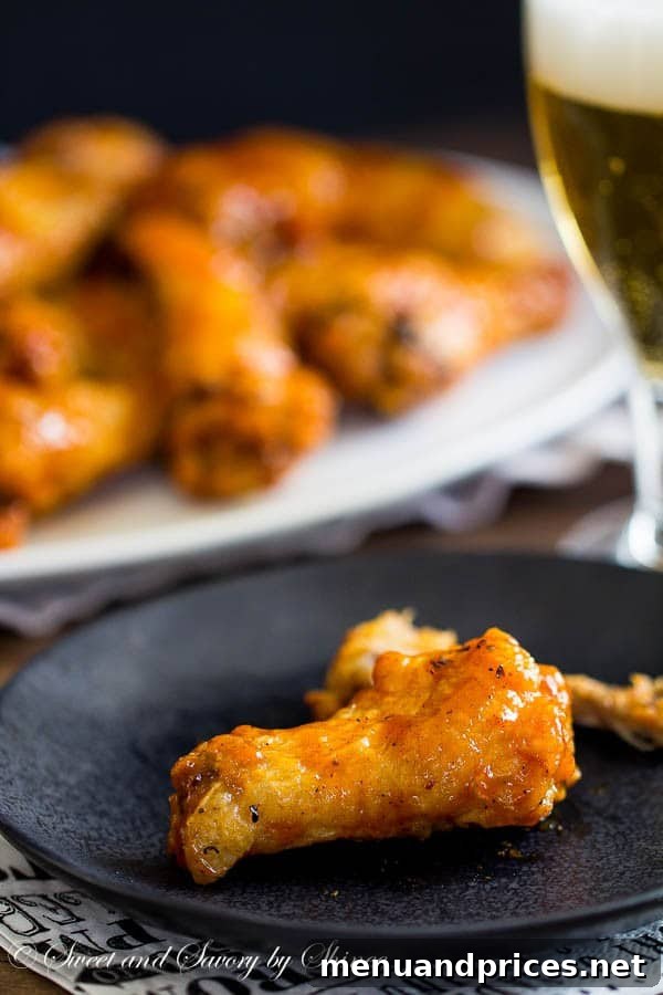 Fiery Jamaican Jerk Wings 3 Sticky, messy, and absolutely irresistible, these Jamaican jerk chicken wings are baked to crisp perfection and tossed in your favorite jerk sauce.