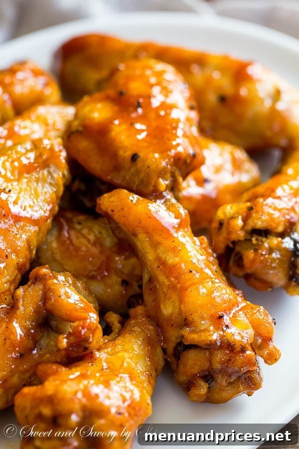 Fiery Jamaican Jerk Wings 4 Sticky, messy, and absolutely irresistible, these Jamaican jerk chicken wings are baked to crisp perfection and tossed in your favorite jerk sauce.