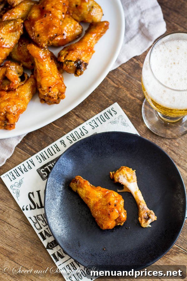 Fiery Jamaican Jerk Wings 6 Sticky, messy, and absolutely irresistible, these Jamaican jerk chicken wings are baked to crisp perfection and tossed in your favorite jerk sauce.