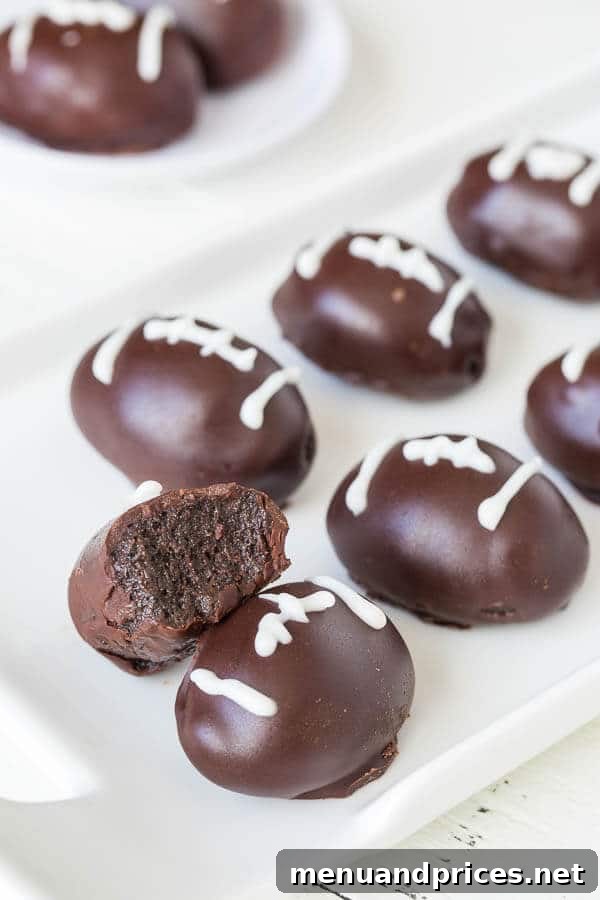 Decadent No-Bake Triple Chocolate OREO Truffles 3 Delicious OREO cookie balls with a creamy filling and chocolate coating, ready for a football-themed game day