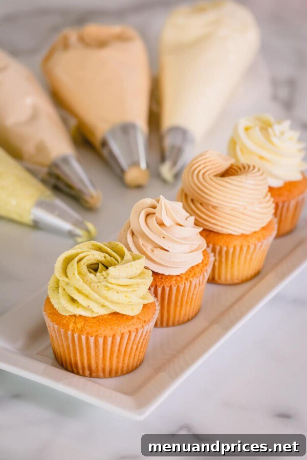 Fluffy American Buttercream Recipe 5 Colorful American buttercream swirls on cupcakes