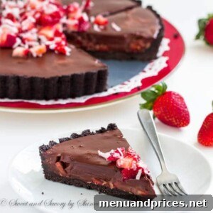 Decadent Chocolate Dream Tart 7 Finished chocolate truffle tart with fresh fruit and coconut garnish.