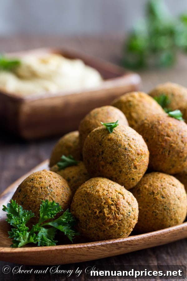 Craft Your Own Falafel 2 Crispy homemade vegetarian falafel balls served with fresh herbs, ready to be enjoyed.