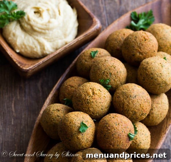Craft Your Own Falafel 3 Close-up of freshly fried falafel balls, golden-brown and promising a crispy texture.