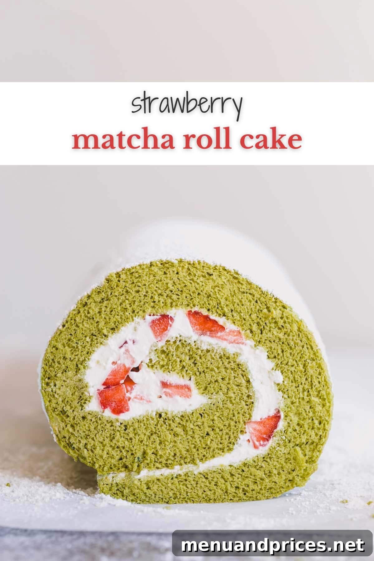 Green tea roll cake filled with whipped cream and strawberries, beautifully sliced.