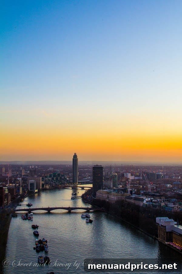 London Visual Diary 19 A vibrant sunset over London, with the city lights beginning to twinkle.