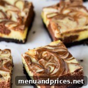Delicious Triple Chocolate Cheesecake Bars ready to eat.