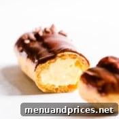 Divine Chocolate Eclairs 15 Sliced chocolate eclair filled with pastry cream.