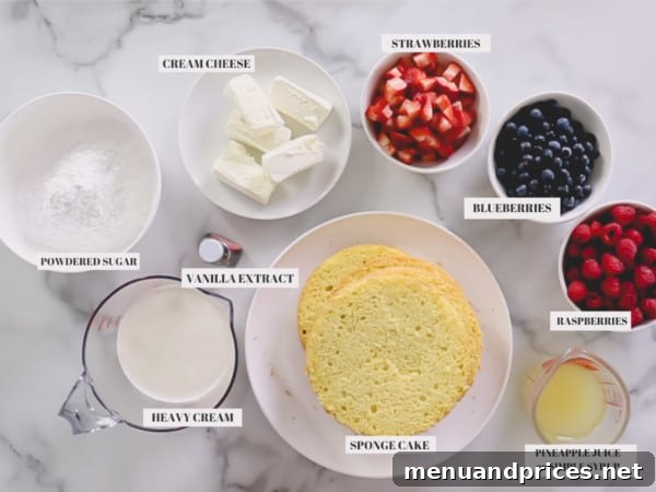 Fresh Berry Chantilly Delight 5 An array of ingredients for Berry Chantilly Cake, including fresh berries, cream cheese, heavy cream, and cake flour, neatly arranged on a kitchen counter.