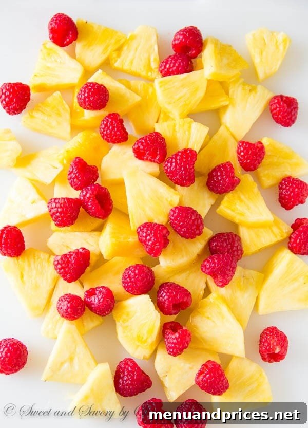 Close-up of Pineapple Raspberry Sangria with visible fruit slices