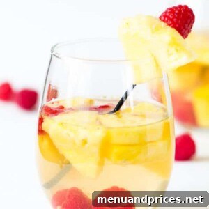 Pineapple Raspberry Sangria in a glass