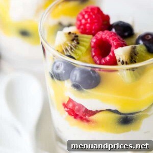 Whipped Lemon Delight 7 Lemon Chantilly Parfait with fresh fruit garnish in a glass