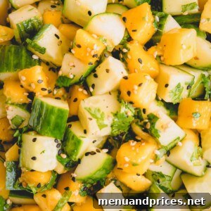 A small, round image of the refreshing cucumber mango salad.