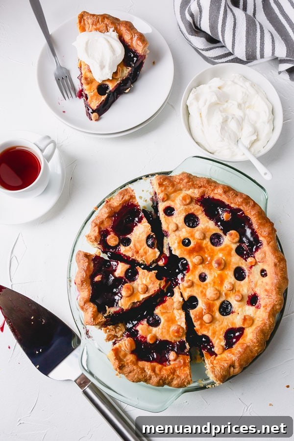 A whole, perfectly baked homemade sweet cherry pie, ready to be sliced and served, promising a delightful dessert experience.