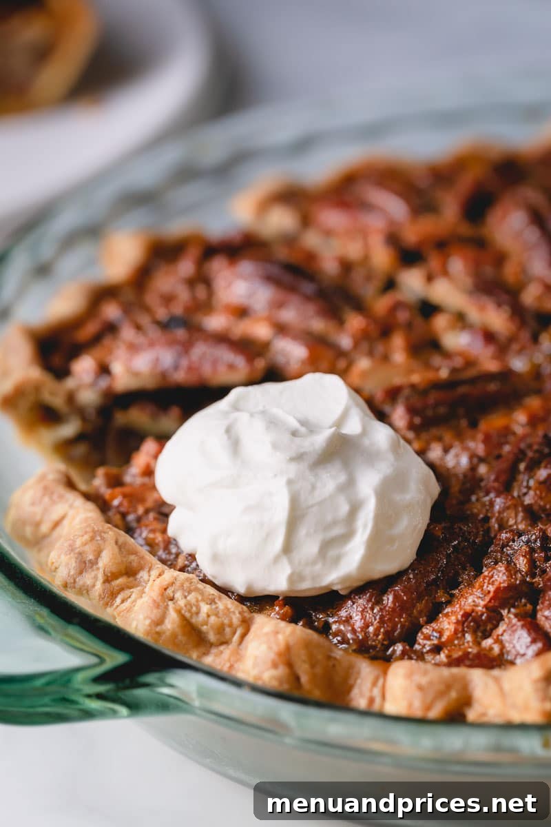 Cloud-Like Homemade Whipped Cream 6 A slice of pecan pie, beautifully garnished with a generous dollop of fluffy yogurt whipped cream.