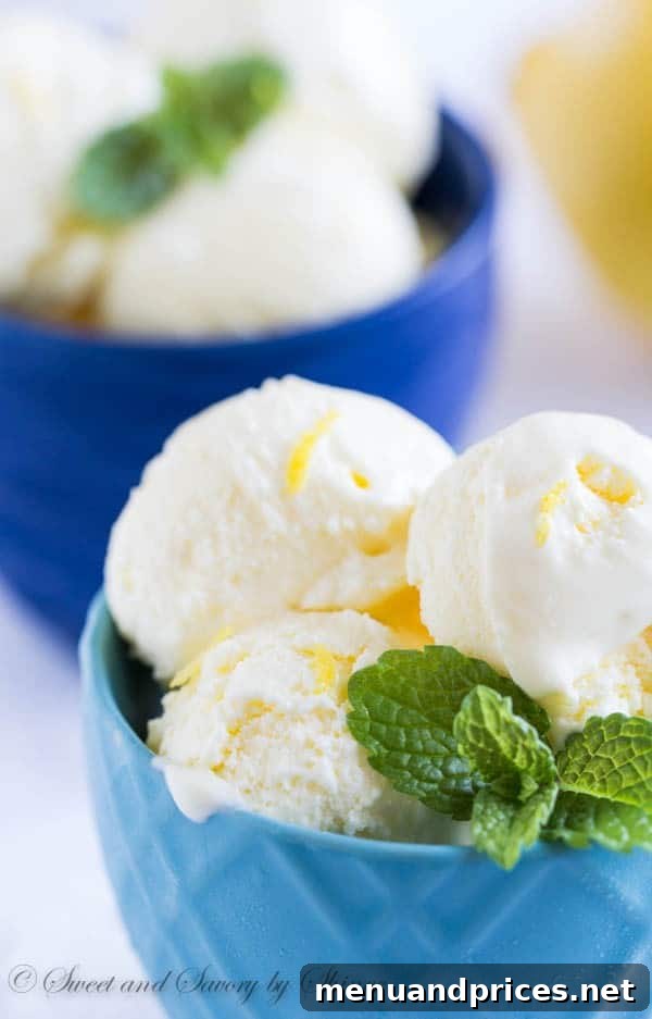 Zesty Lemon Dream 3 Close-up shot of a single scoop of lemon ice cream, showcasing its smooth texture and light yellow hue.