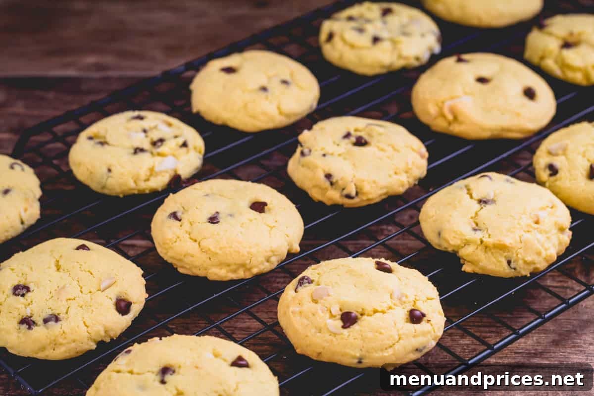 Golden Yolk Delights 5 Warm chocolate chip cookies cooling on a wire rack after being removed from the oven.
