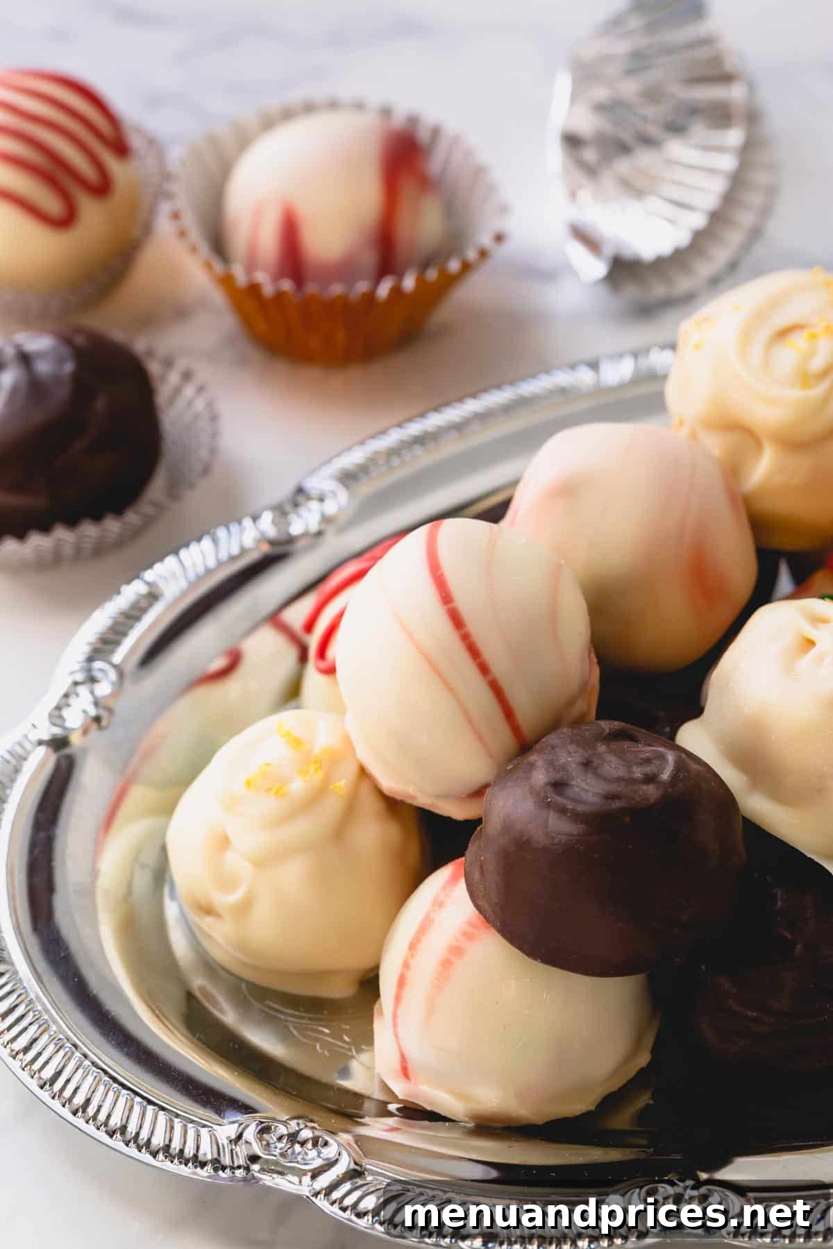 White chocolate coated Oreo balls, delicately adorned.