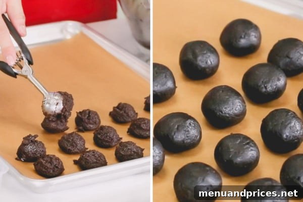 The process of shaping creamy Oreo mixture into smooth, uniform balls.