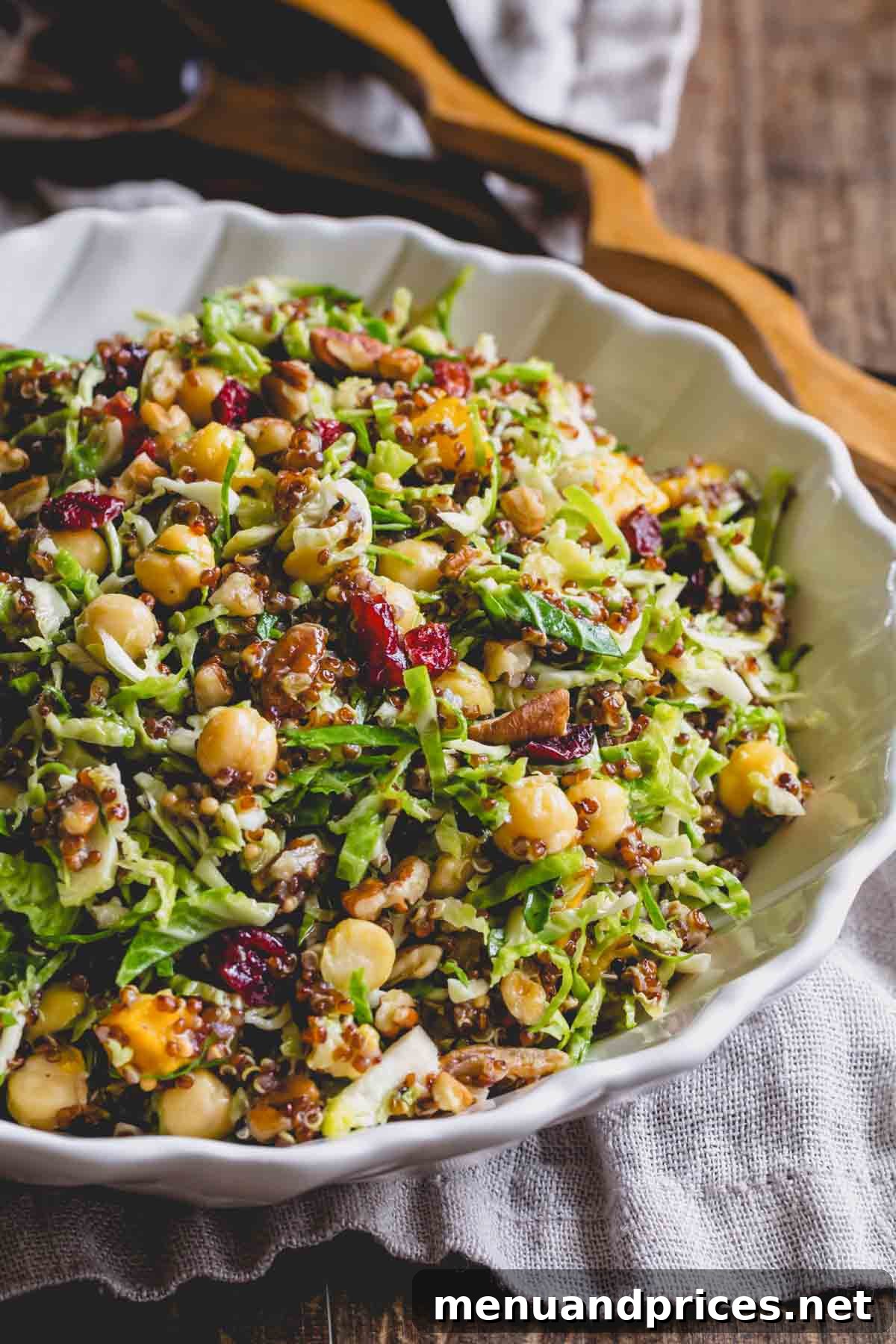 Roasted Brussels Quinoa Harvest Bowl 2 Warm quinoa Brussels sprouts salad with chickpeas in a bowl, showcasing its vibrant colors and textures.
