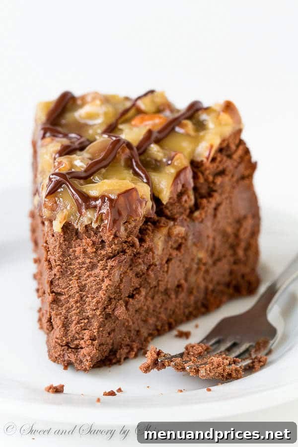 Decadent German Chocolate Cheesecake 6 A beautifully presented slice of German Chocolate Cheesecake, garnished and ready to be enjoyed, emphasizing its deep chocolate hue and the luscious texture of the topping and filling.