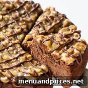 Decadent German Chocolate Cheesecake 8 A small, tantalizing slice of German Chocolate Cheesecake, enticing and rich, promising a delightful culinary experience.