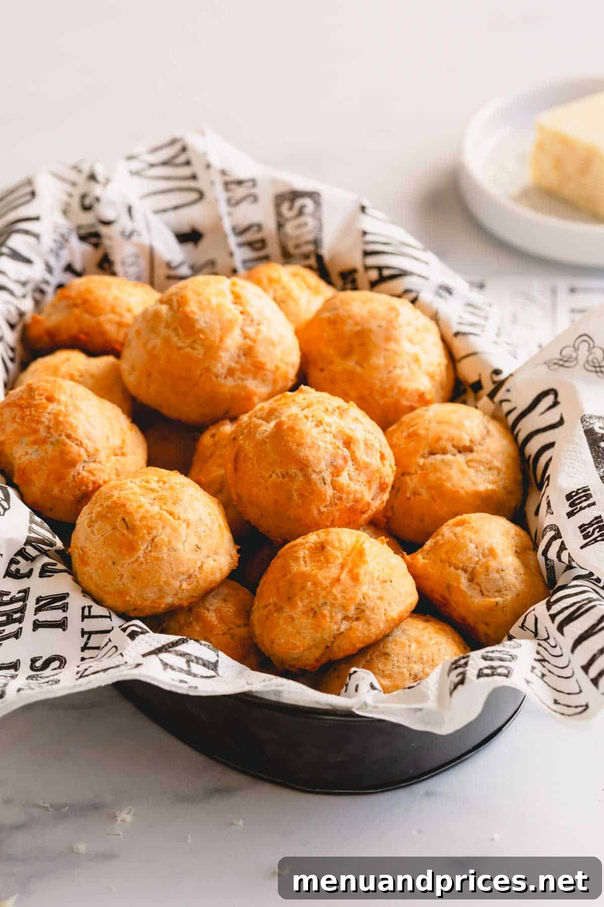 Fluffy Havarti Cheese Gougères 2 A beautiful platter overflowing with golden, perfectly round Havarti cheese puffs.