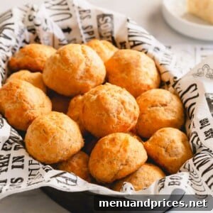 A platter of golden round cheese puffs piled up.