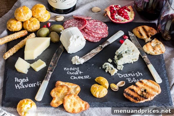 Cozy Valentine's Day cheese board with wine (or grape juice!), showing an inviting spread for a romantic evening at home