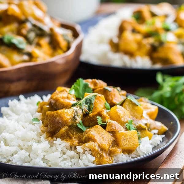 Golden Chicken Bok Choy Curry 6 A beautifully plated bowl of Bok Choy and Chicken Curry, garnished generously with fresh cilantro, ready to be served over steamed rice.
