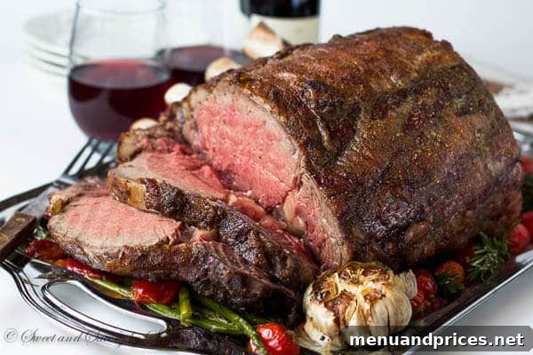 A festive holiday table setting featuring a roasted prime rib as the centerpiece.