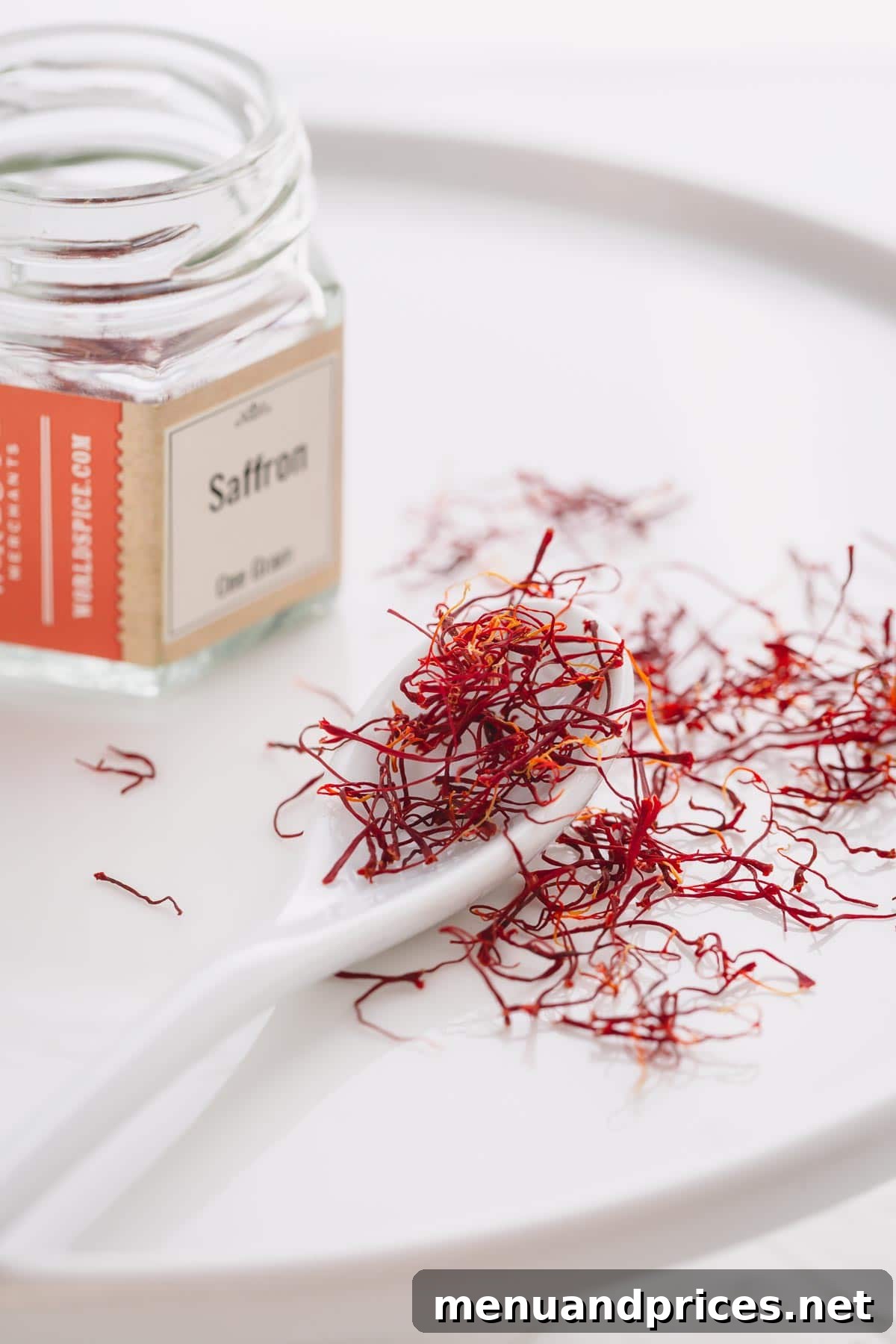 Sun-Drenched Saffron Rice 4 Saffron threads on counter top with spoon
