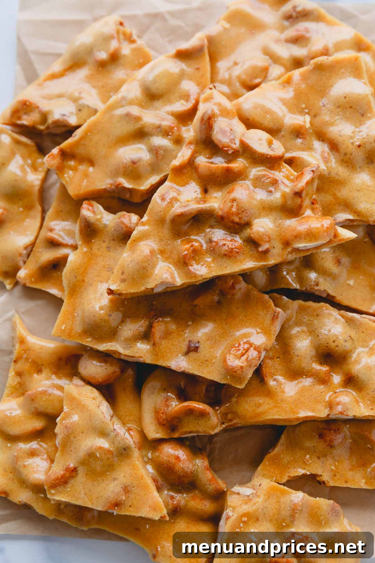 Beautifully broken pieces of crunchy homemade peanut brittle, ready to be enjoyed.