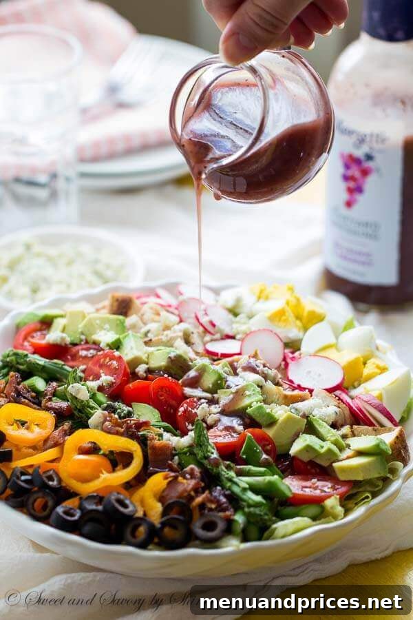 Artfully arranged Spring Cobb Salad with fresh ingredients and Marzetti dressing