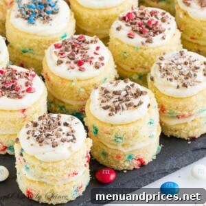 Finished Funfetti Mini Layer Cakes with festive cream cheese frosting and colorful M&M toppings