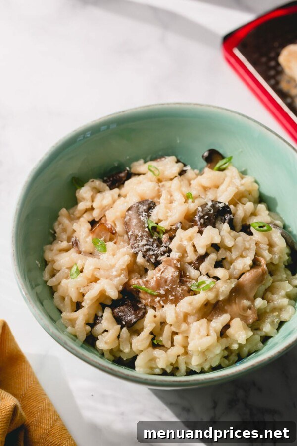 Easy Creamy Instant Pot Mushroom Risotto 2 Instant Pot Mushroom Risotto served in a bowl, garnished with fresh parsley.