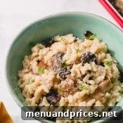 Instant Pot Mushroom Risotto garnished with fresh herbs.