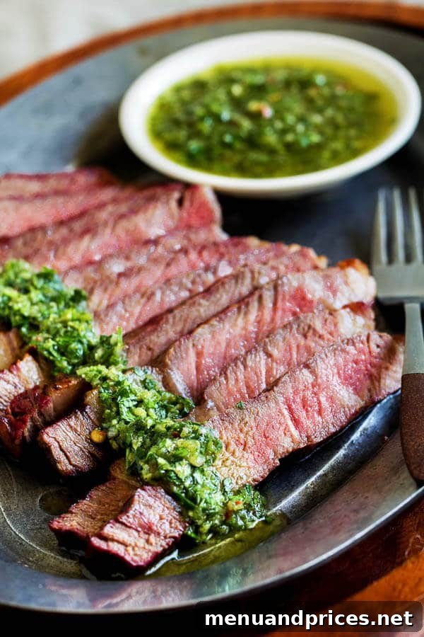 Grilled Ribeye Perfection with Fresh Chimichurri 2 Perfectly grilled ribeye steaks with fresh green chimichurri sauce