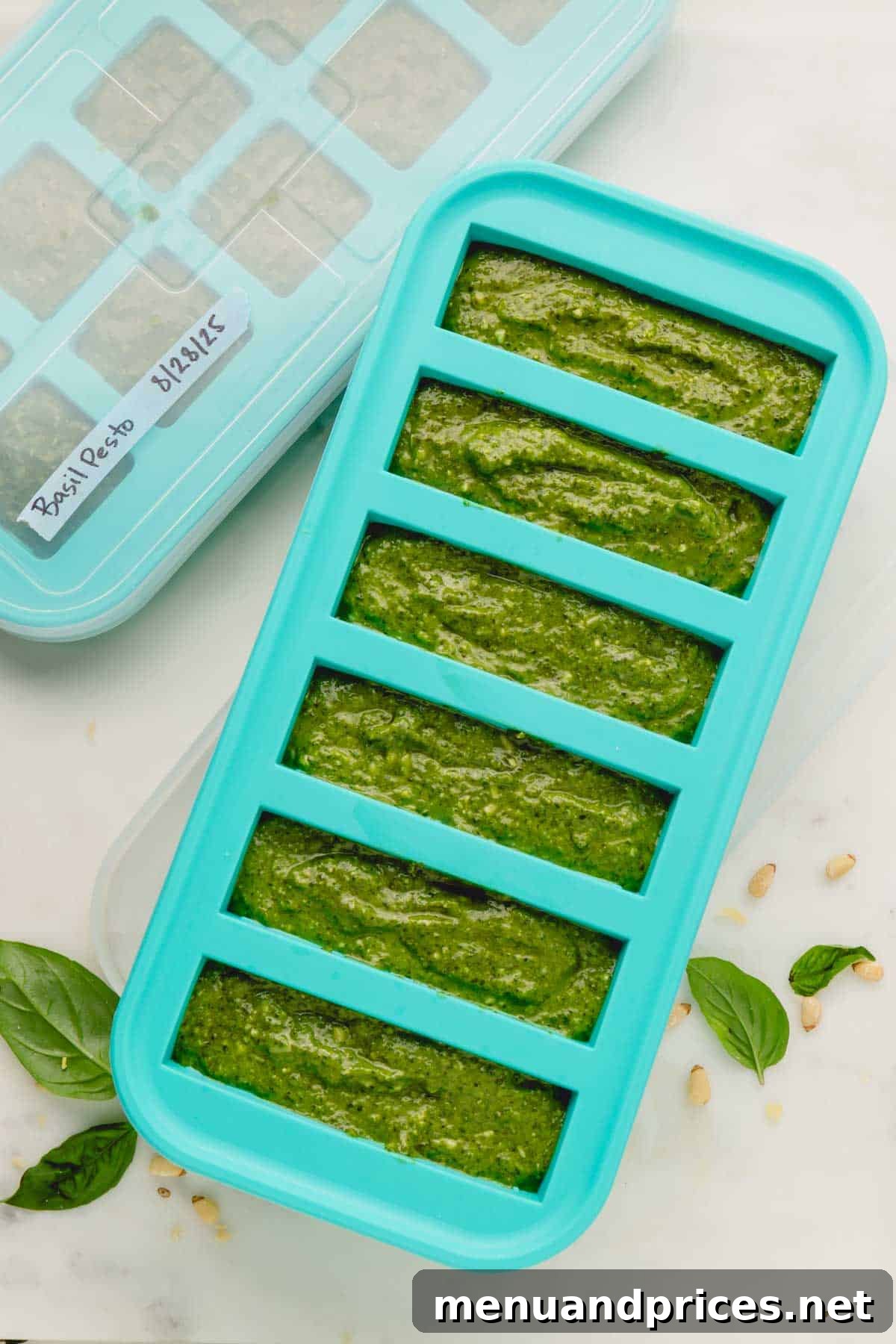 Big Batch Basil Pesto: A Freezer-Friendly Recipe 15 Homemade basil pesto neatly stored in a silicone souper cube tray, ready for freezing.