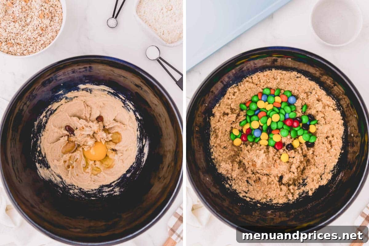 Close-up of freshly prepared apple cinnamon oatmeal cookie dough speckled with colorful M&M's in a mixing bowl, ready to be scooped and baked.