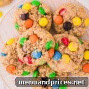A plate of apple cinnamon oatmeal cookies with M&M's, a delightful and easy-to-make dessert.