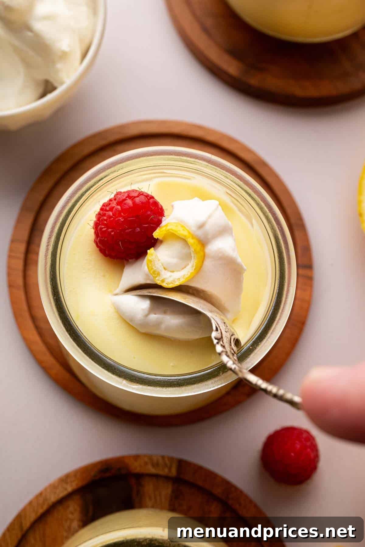 Zesty Lemon Dream 3 Overhead image of lemon mousse with a spoon scooping in.