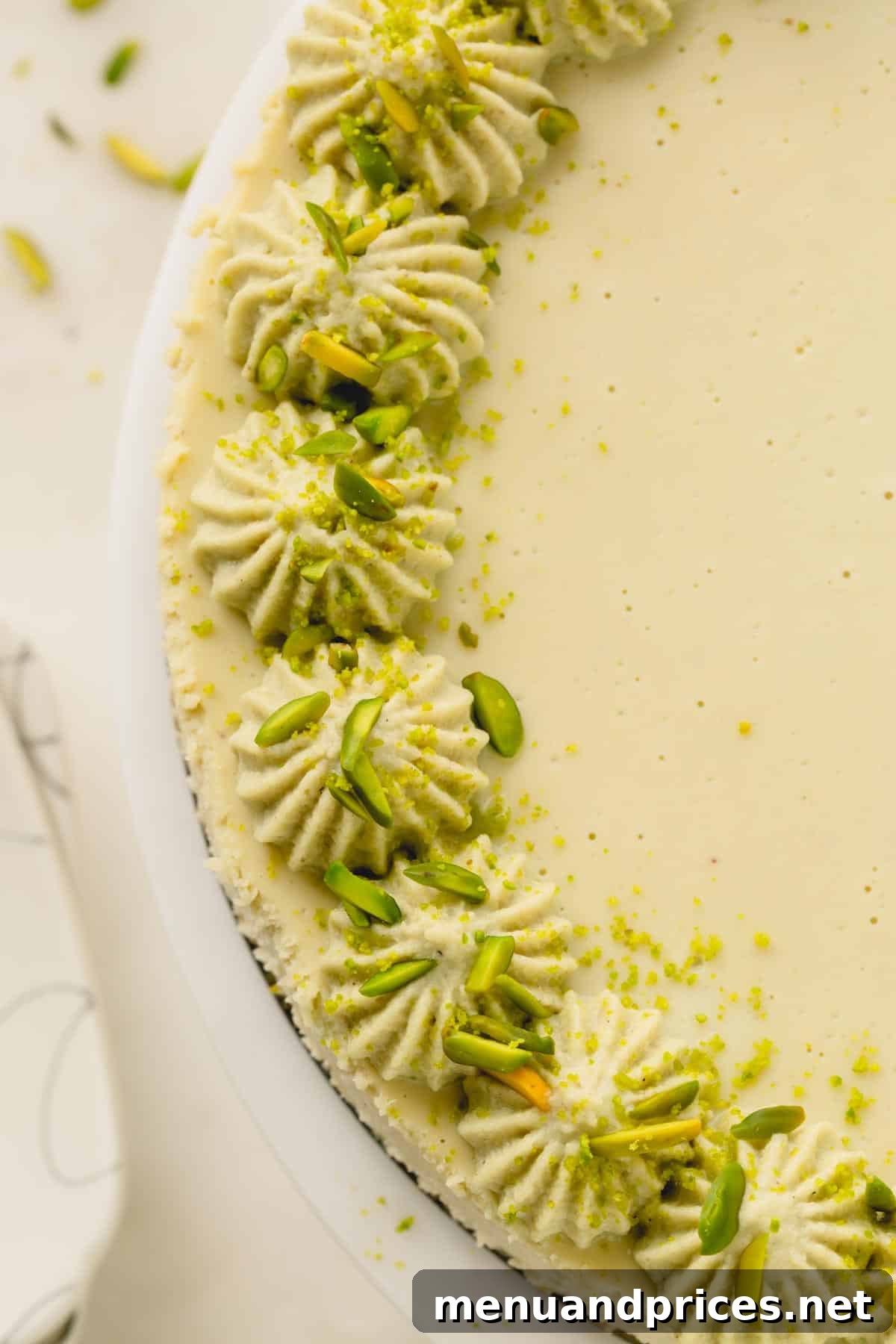 Overhead image of half of a pistachio cheesecake.